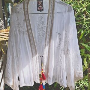 Johnny was super sheer  light jacket with pom pom ties.